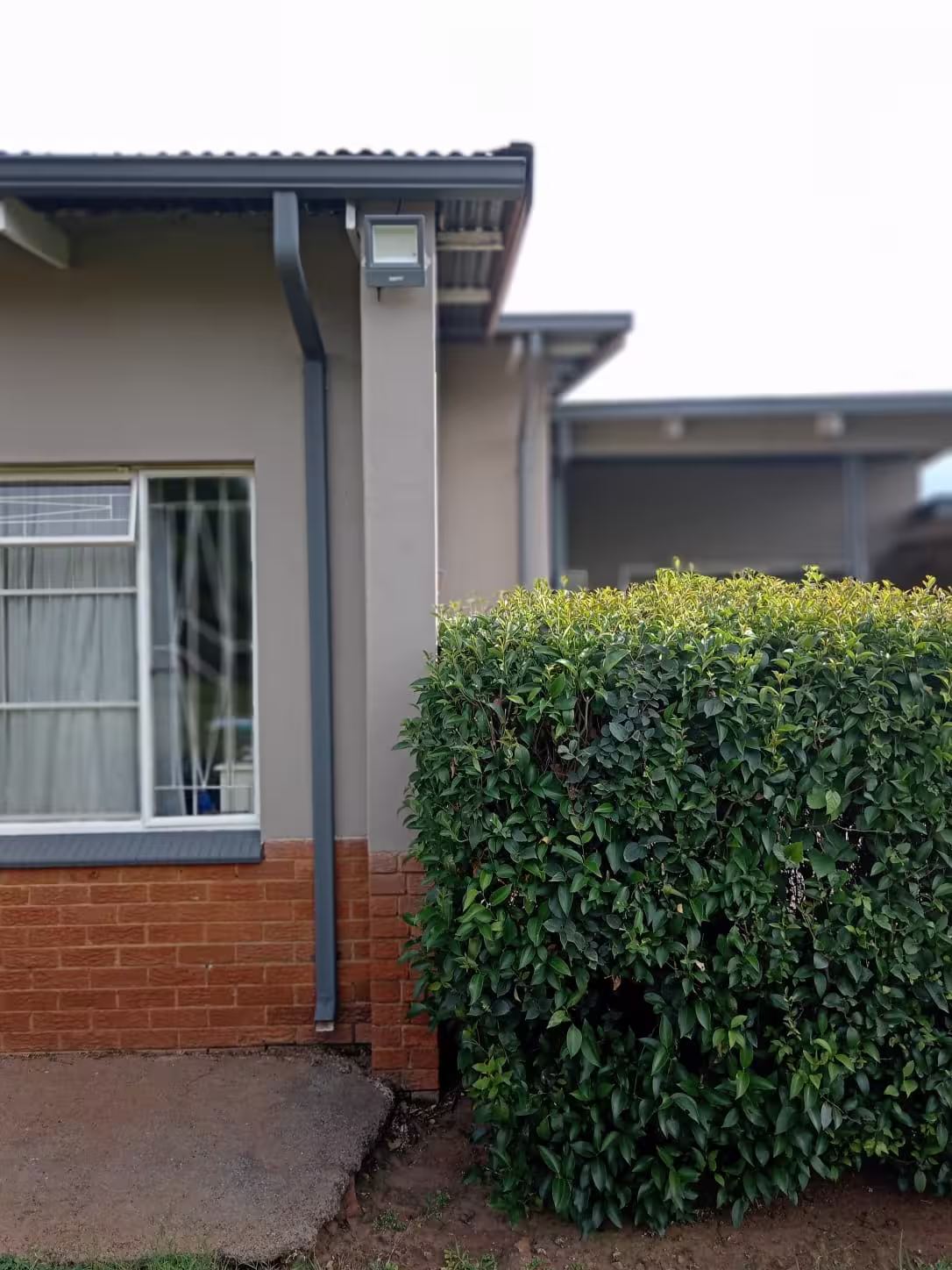 Gutters Before Replacement — RR Roof Waterproofing, Centurion Damaged and sagging old gutters on residential home before replacement — Centurion