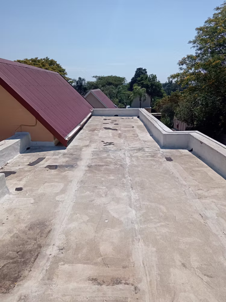 Flat Roof Before Torch-On Waterproofing — RR Roof Waterproofing, Centurion Flat roof before torch-on waterproofing showing cracked and deteriorated surface — Centurion